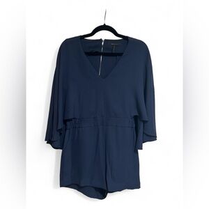 BCBG cape romper in navy blue with rear button closure